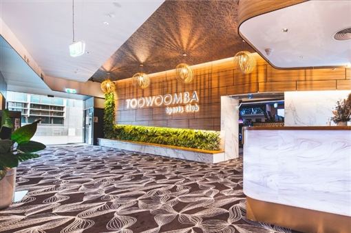 The club's reception, with the Toowoomba Sports Club sign on a timber wall